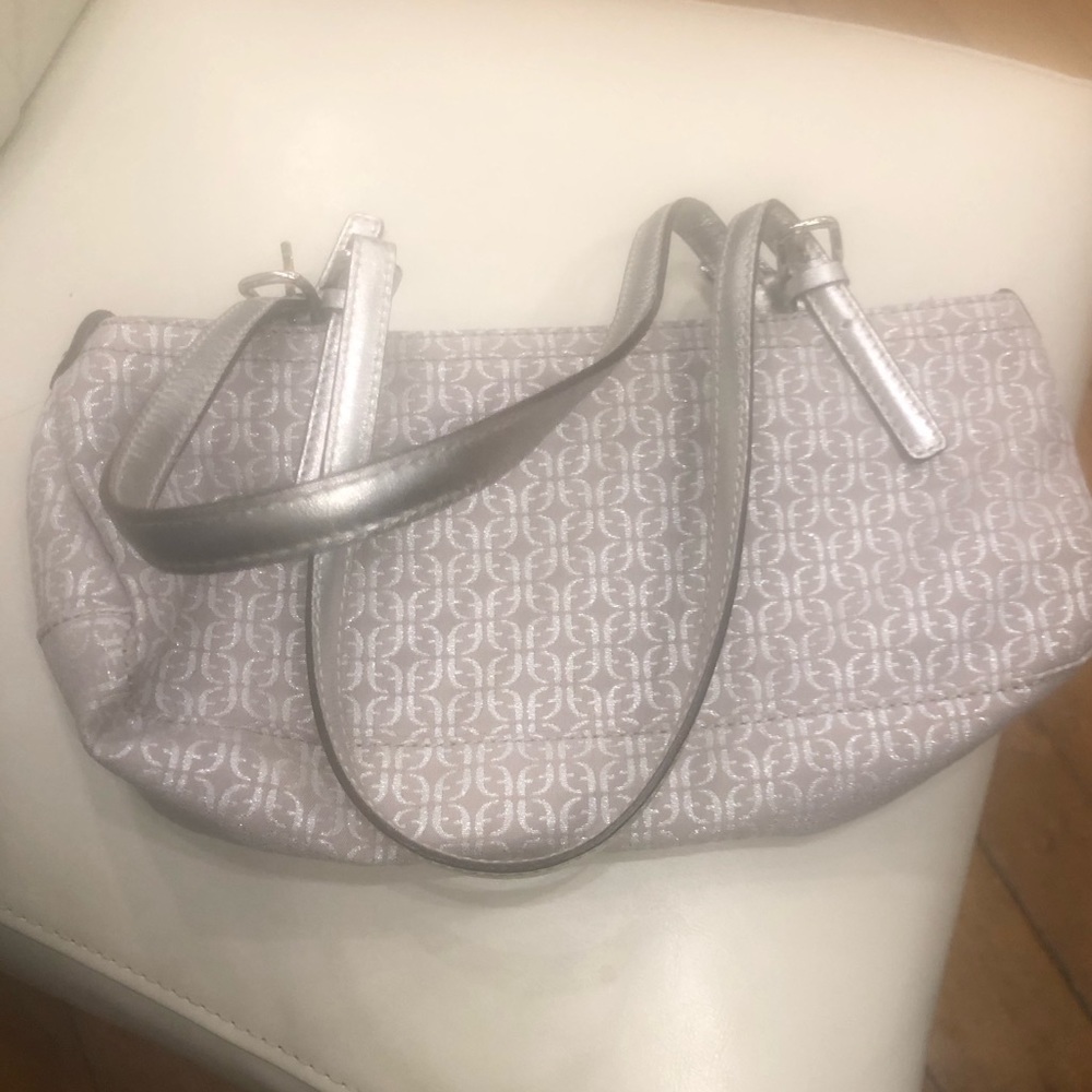 Beautiful shape, like new. Gorgeous silver hand bag!